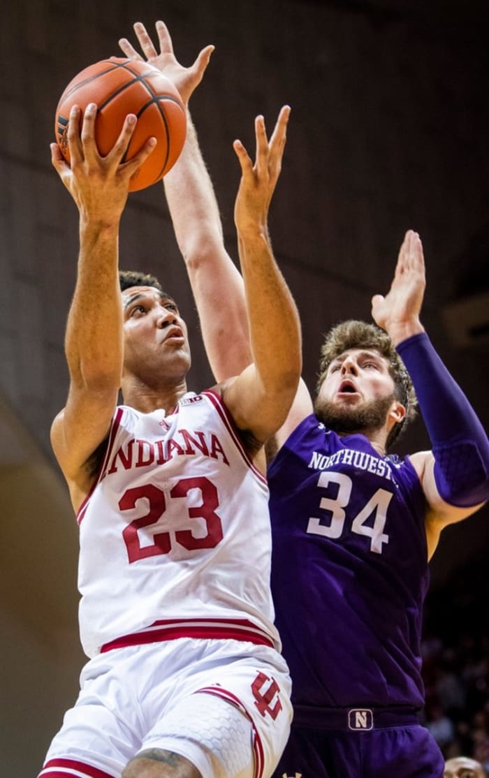 Indiana's Trayce Jackson-Davis (23) goes up against Northwestern's Matthew Nicholson (34) during the first half ot the Indiana versus Northwestern men's basketball game at Simon Skjodt Assembly Hall on Sunday, Jan. 8, 2023.